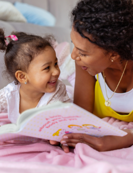 Cheerful young mother communicating with her daughter